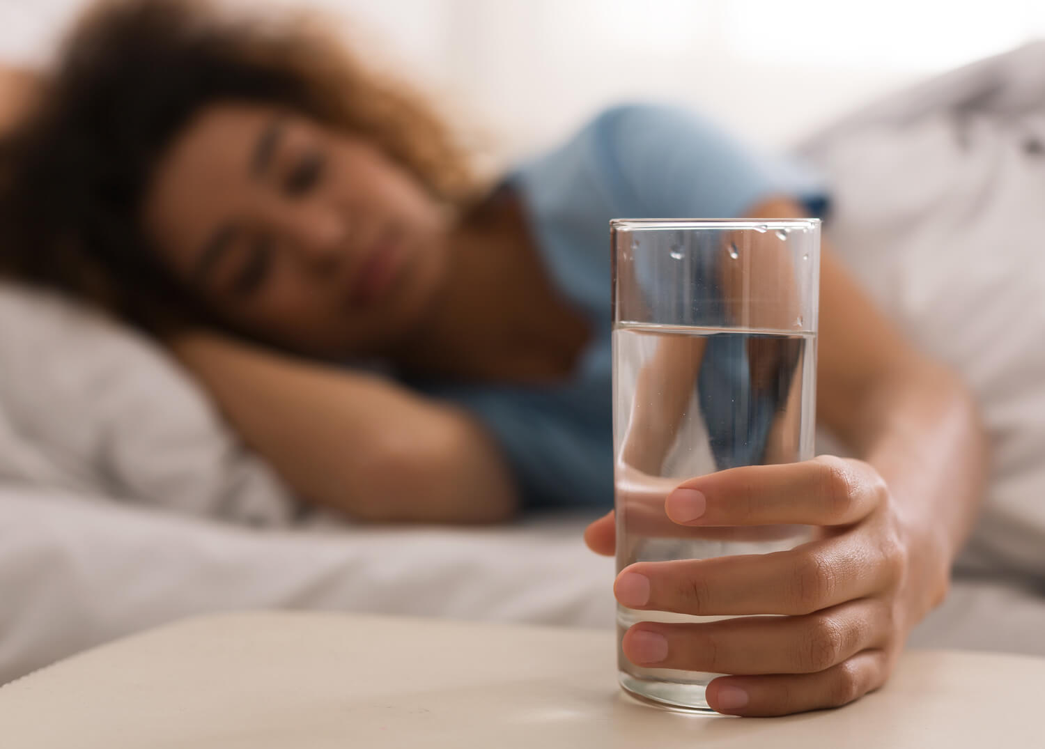 Woman holding a glass of water