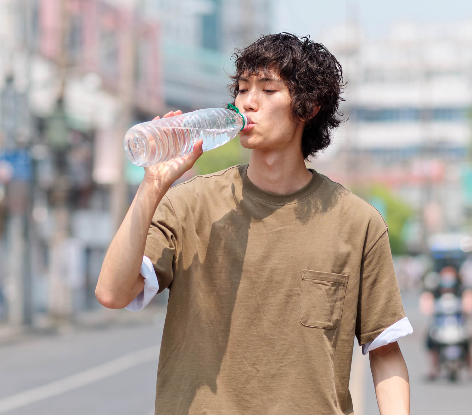 Man drinking from a water bottle